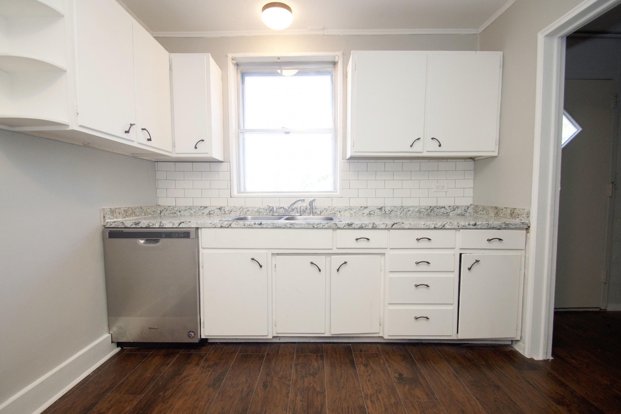 102 Goucher Circle Oak Ridge, TN 37830 - Photo 21 of 37 a kitchen with granite countertop white cabinets and wooden floor