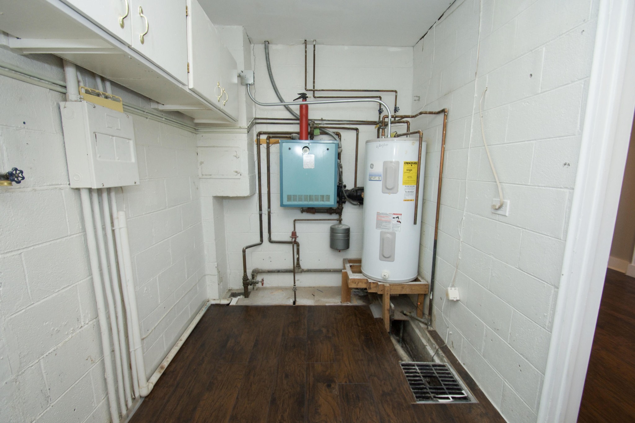 102 Goucher Circle Oak Ridge, TN 37830 - Photo 23 of 37 a view of hallway with stairs and wooden floor