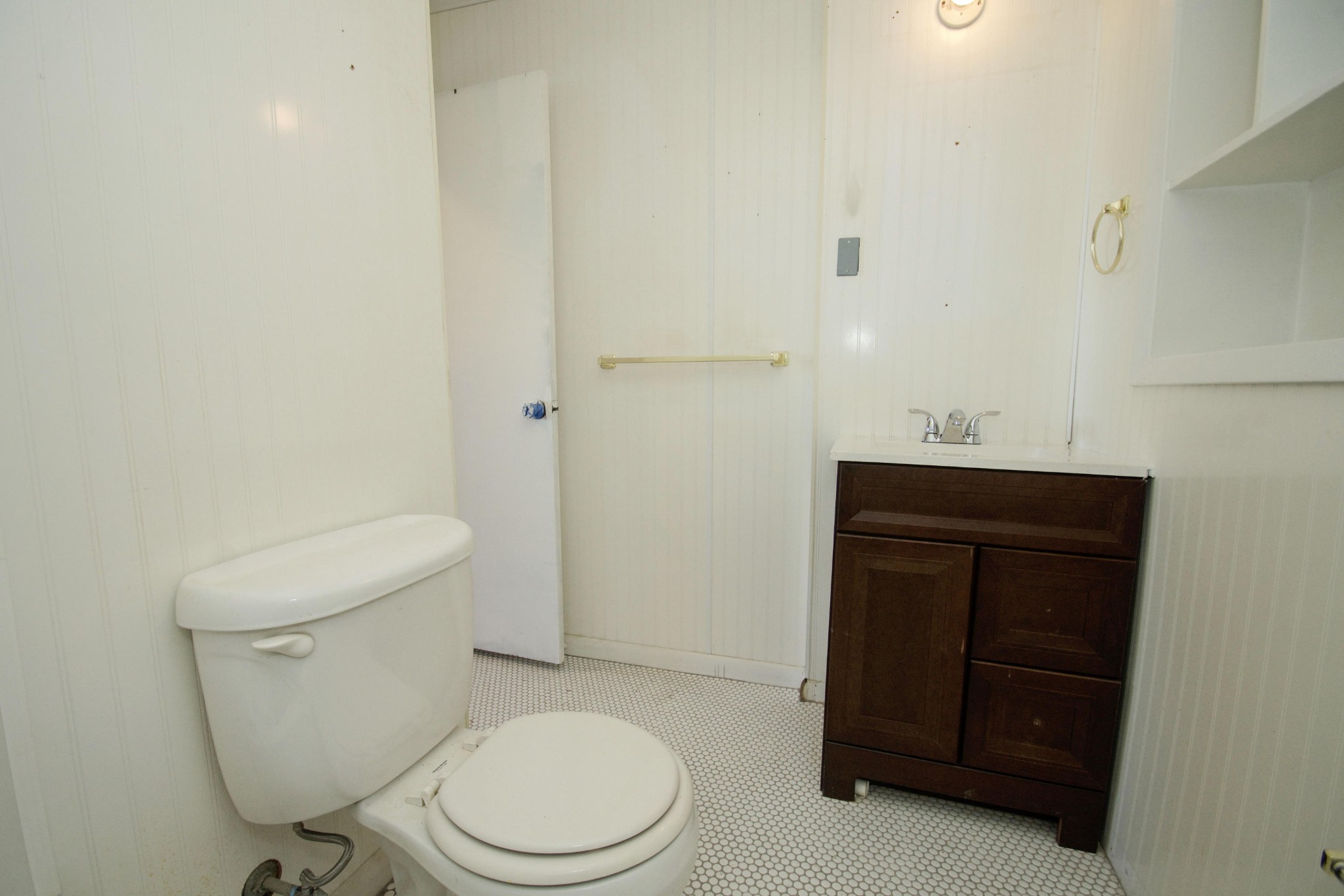 102 Goucher Circle Oak Ridge, TN 37830 - Photo 30 of 37 a white toilet sitting next to a bathroom sink