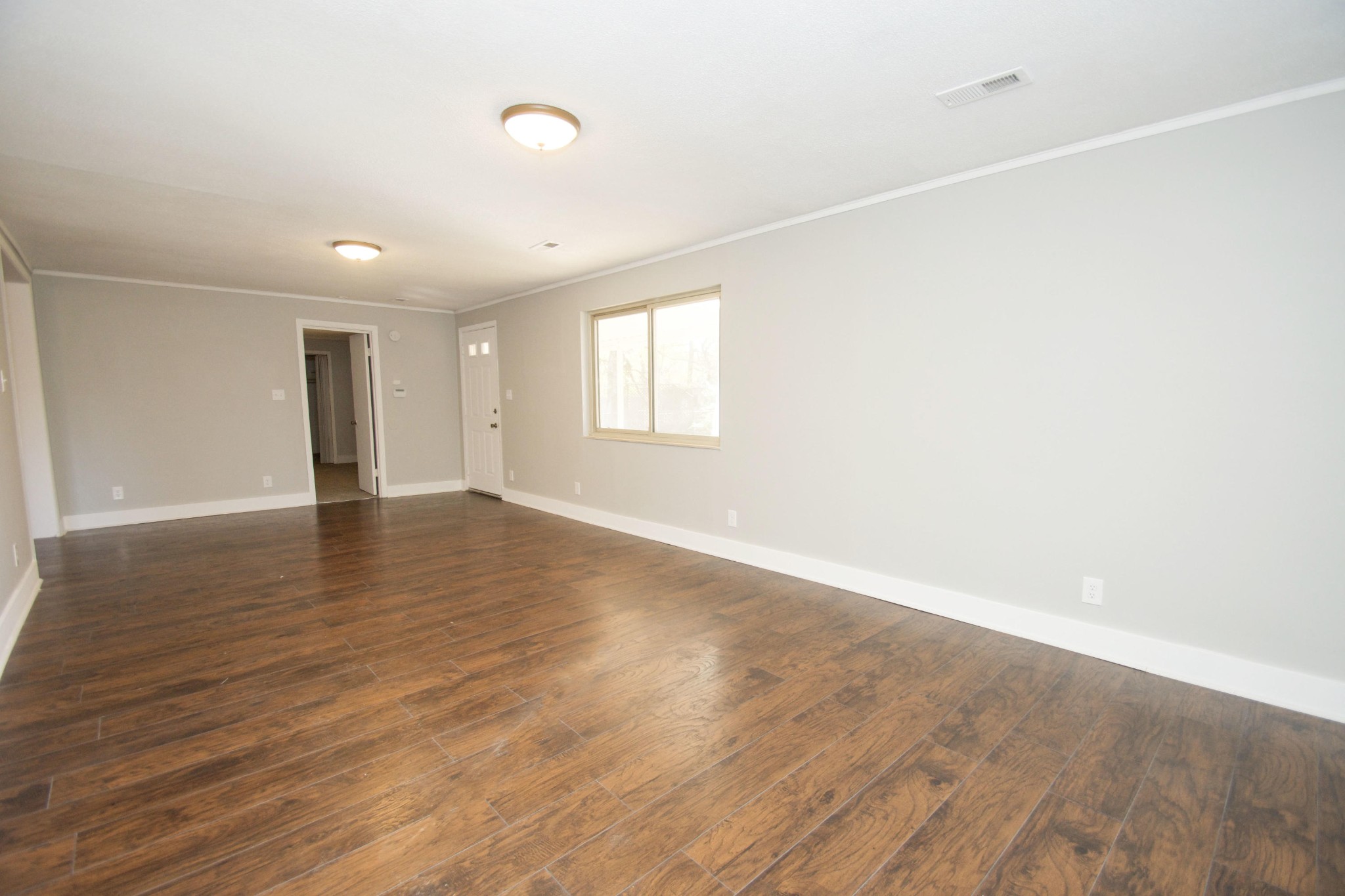102 Goucher Circle Oak Ridge, TN 37830 - Photo 6 of 37 an empty room with wooden floor and windows