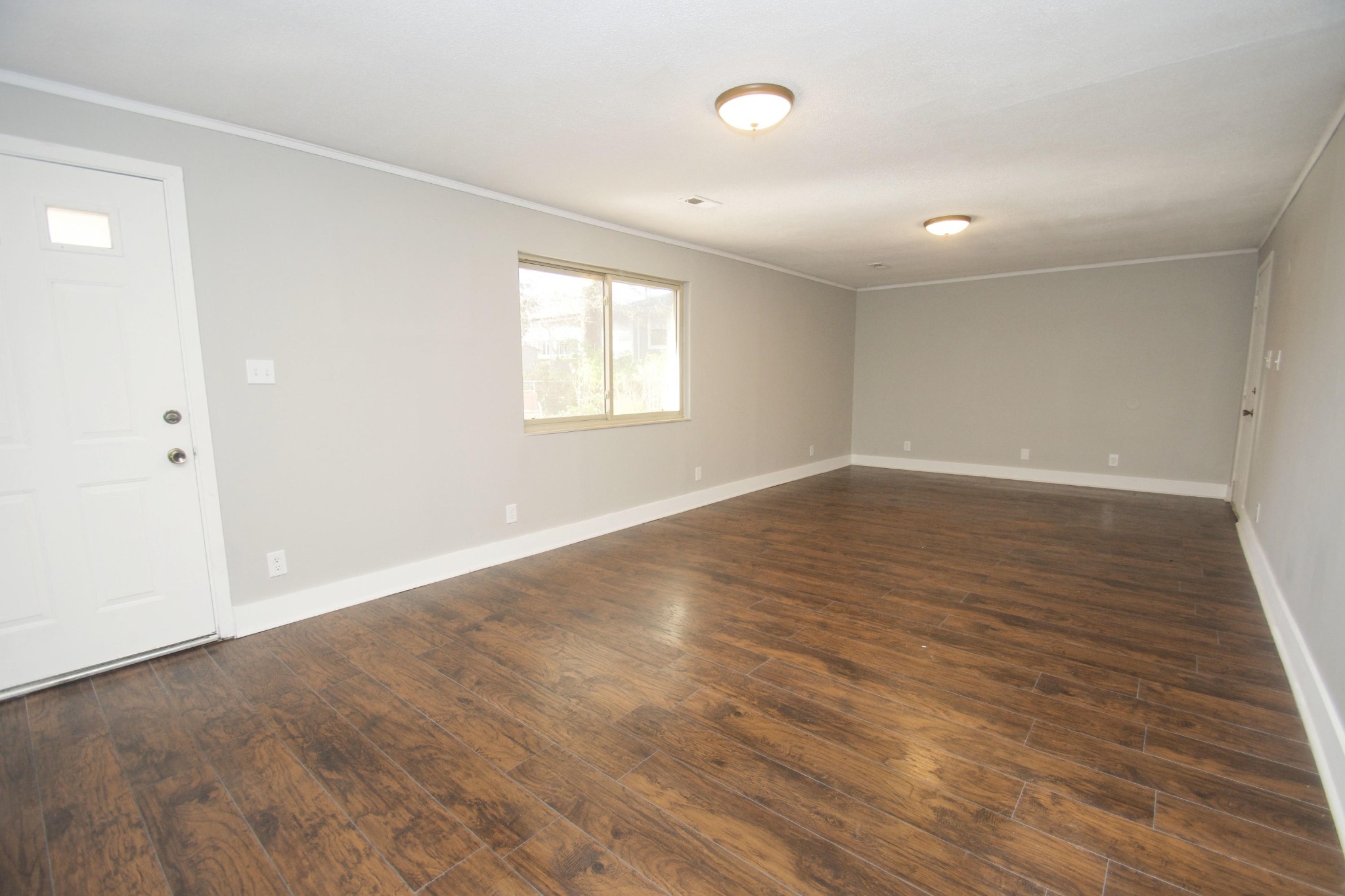 102 Goucher Circle Oak Ridge, TN 37830 - Photo 8 of 37 an empty room with wooden floor and windows