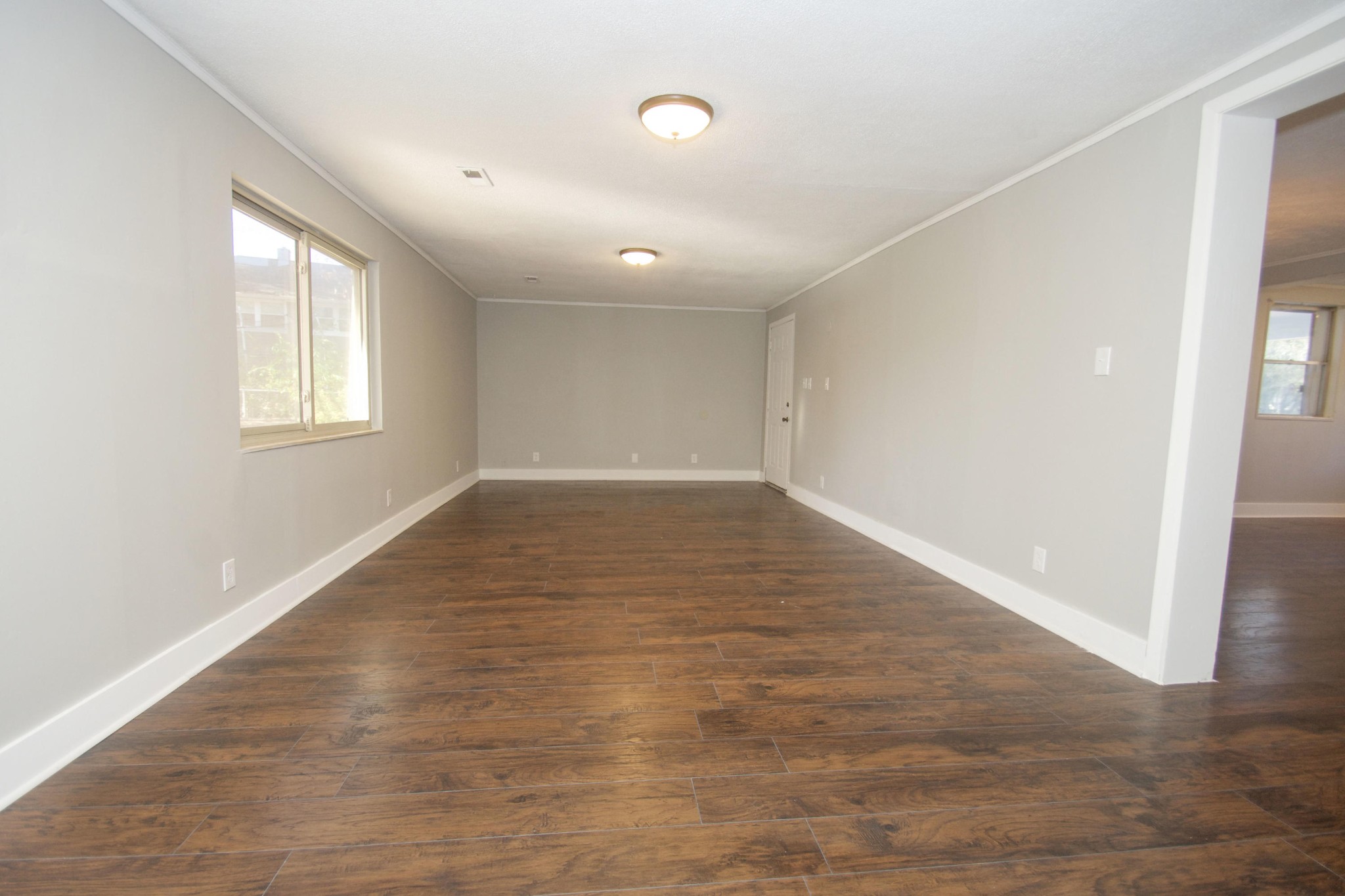 102 Goucher Circle Oak Ridge, TN 37830 - Photo 9 of 37 an empty room with wooden floor and windows