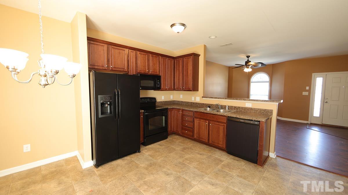 3958 Volkswalk Place Raleigh, NC 27610 - Photo 6 of 17 With dining area.