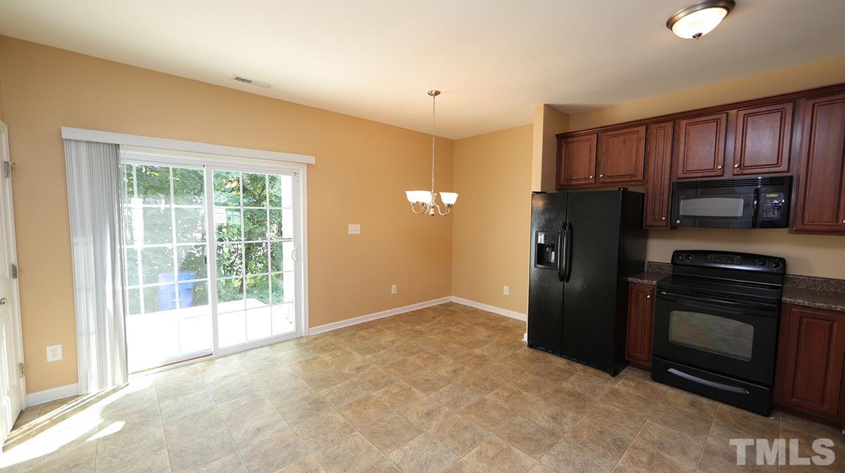 3958 Volkswalk Place Raleigh, NC 27610 - Photo 7 of 17 Dining area and door to patio.