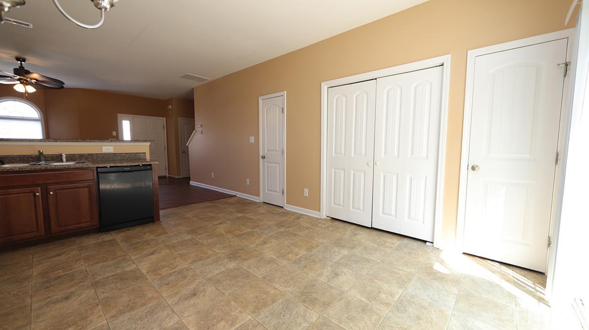 3958 Volkswalk Place Raleigh, NC 27610 - Photo 8 of 17 1/2 bath, laundry area, and pantry.