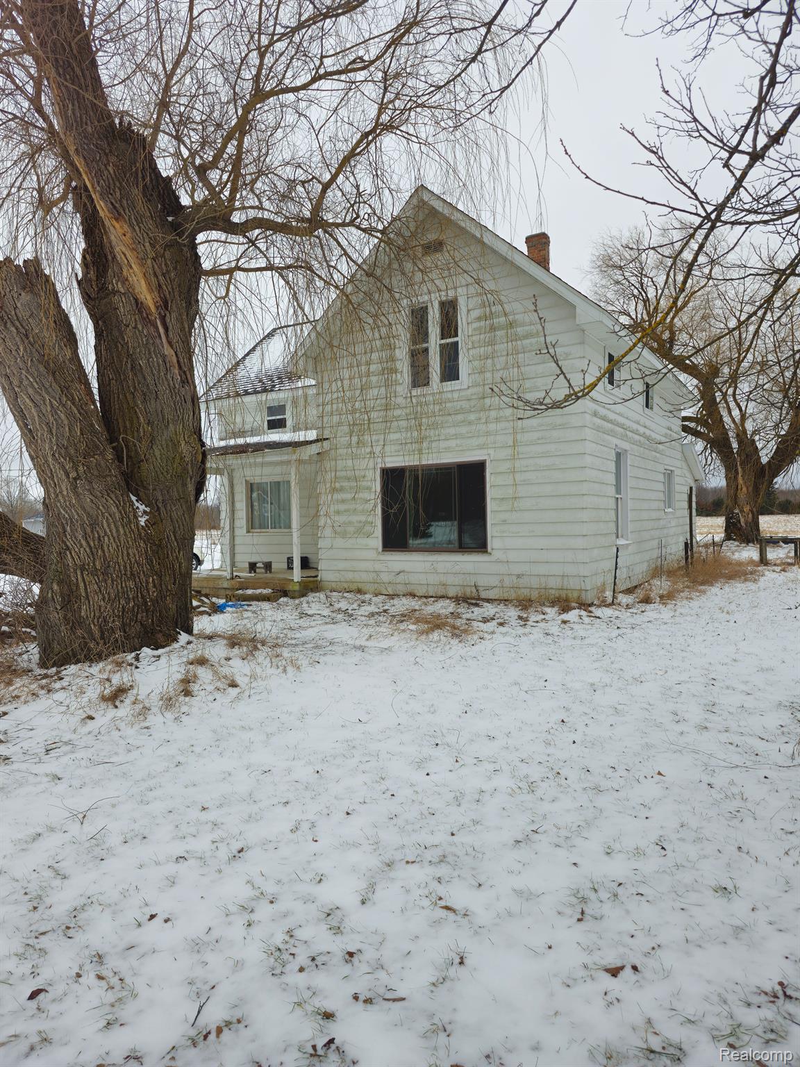9750 East Mike And Tony Road Merritt, MI 49667 - Photo 1 of 15 Farmhouse on 40 a