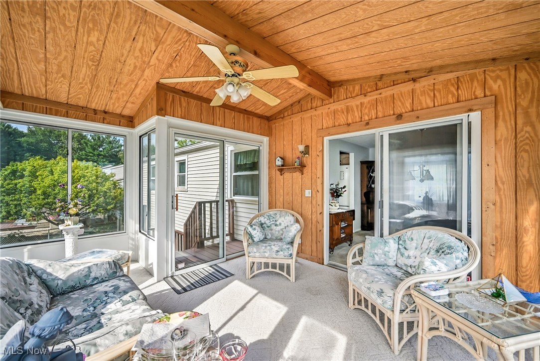 7797 Raglan Drive Northeast Warren, OH 44484 - Photo 25 of 50 Sunroom featuring a ceiling fan and outdoor lounge area