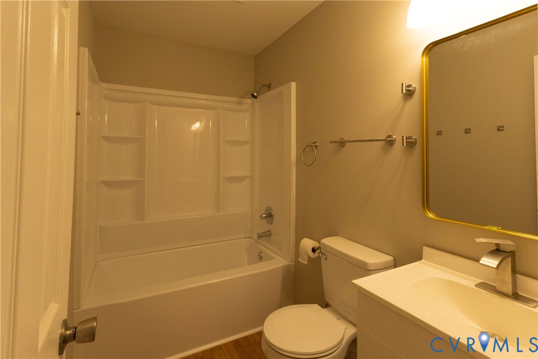 398 Blinkys Road New Canton, VA 23123 - Photo 14 of 21 a bathroom with a sink toilet and shower