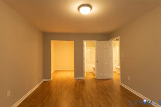 a view of wooden floor and brick walls