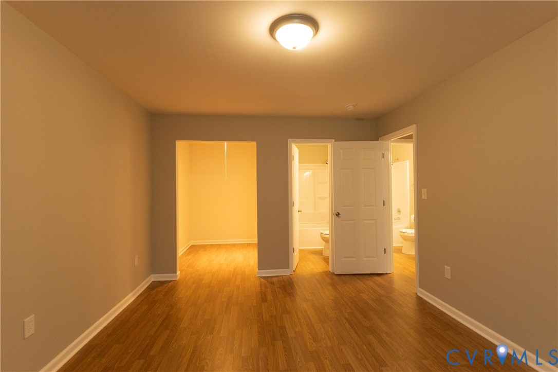 398 Blinkys Road New Canton, VA 23123 - Photo 17 of 21 a view of wooden floor and brick walls