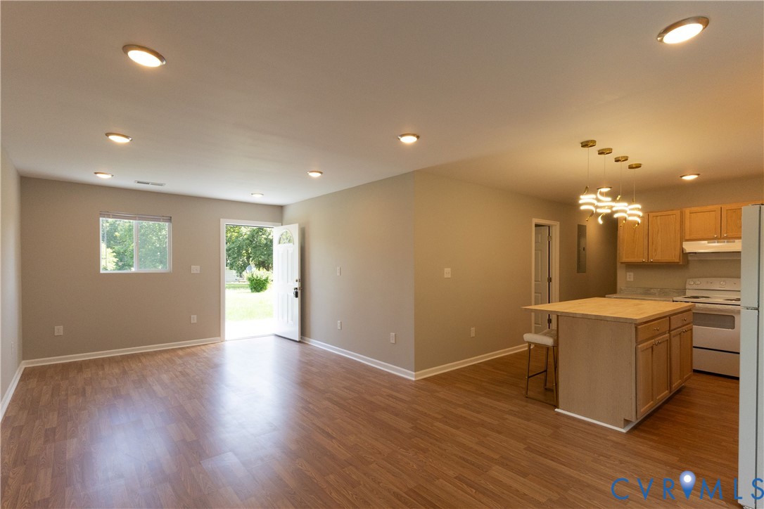 398 Blinkys Road New Canton, VA 23123 - Photo 8 of 21 an empty room with wooden floor and windows