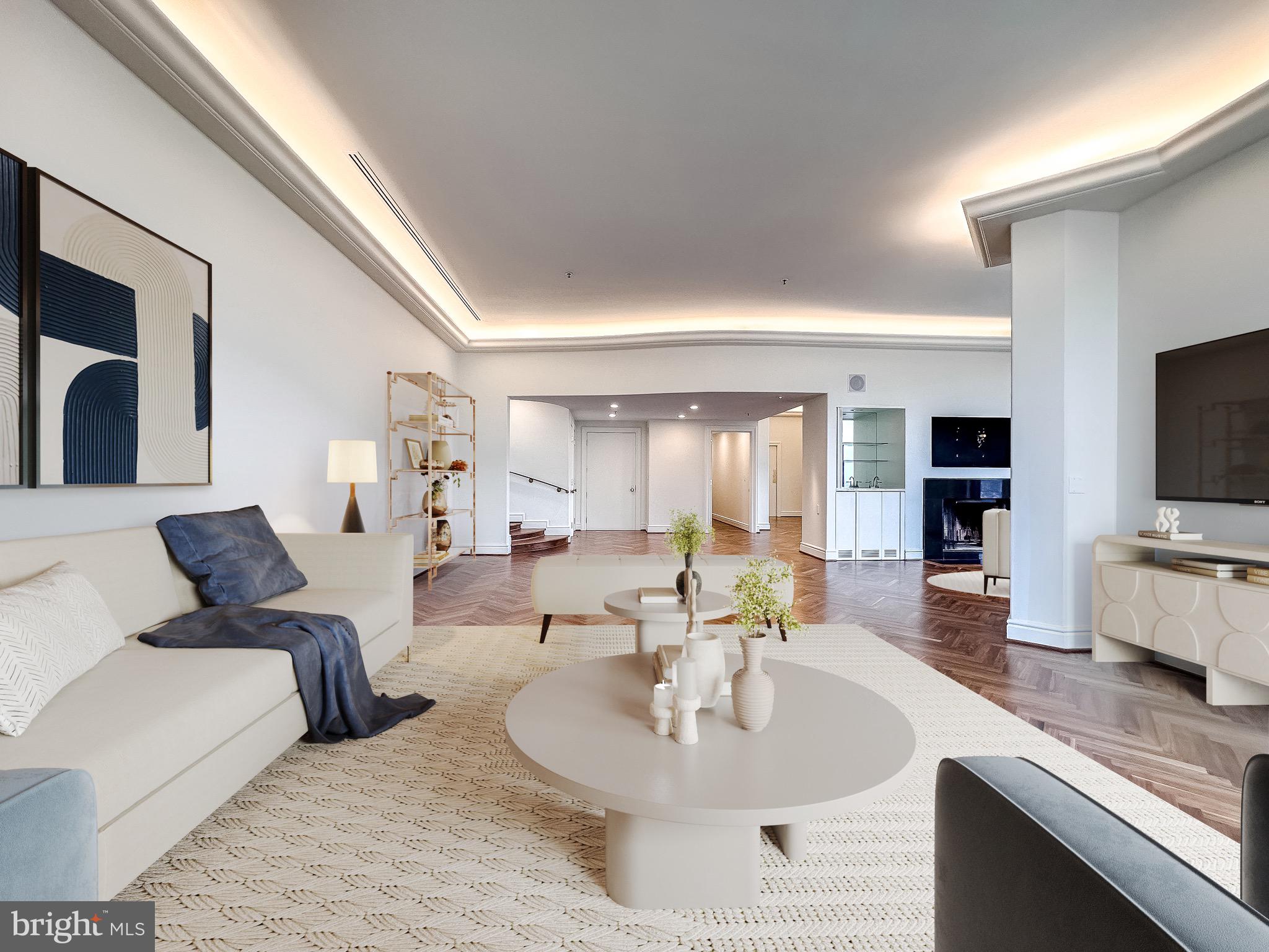 10 East Lee Street, Unit 2701 Baltimore, MD 21202 - Photo 17 of 58 a living room with furniture flat screen tv and kitchen view