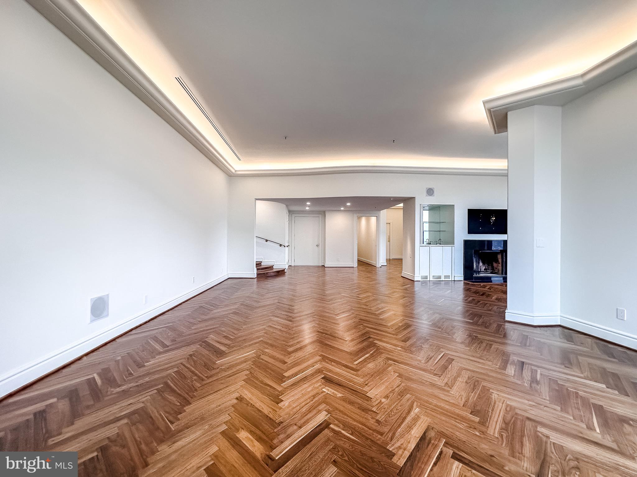 10 East Lee Street, Unit 2701 Baltimore, MD 21202 - Photo 18 of 58 a view of empty room with wooden floor