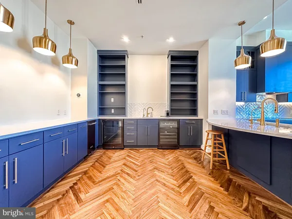 a kitchen with a sink cabinets and window