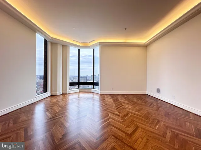 a living room with furniture and a large mirror
