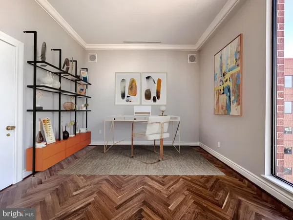a view of an empty room with wooden floor and walls