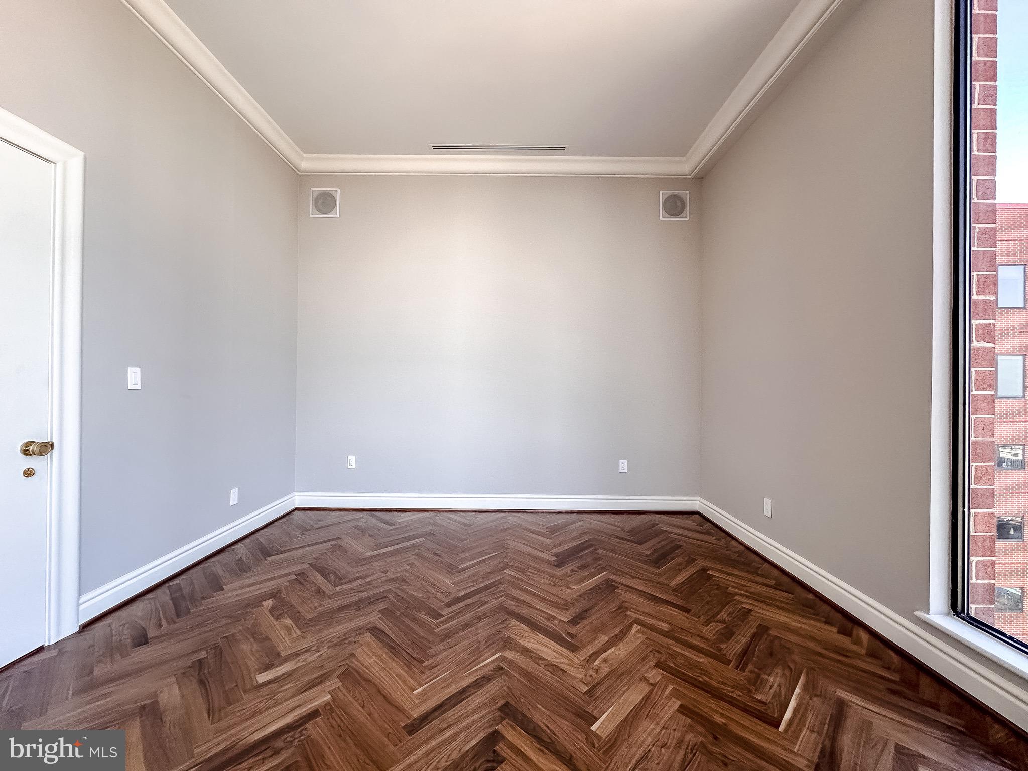10 East Lee Street, Unit 2701 Baltimore, MD 21202 - Photo 29 of 58 a view of a room with wooden floor and closet
