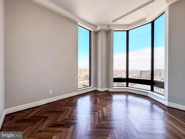 a view of a room with wooden floor