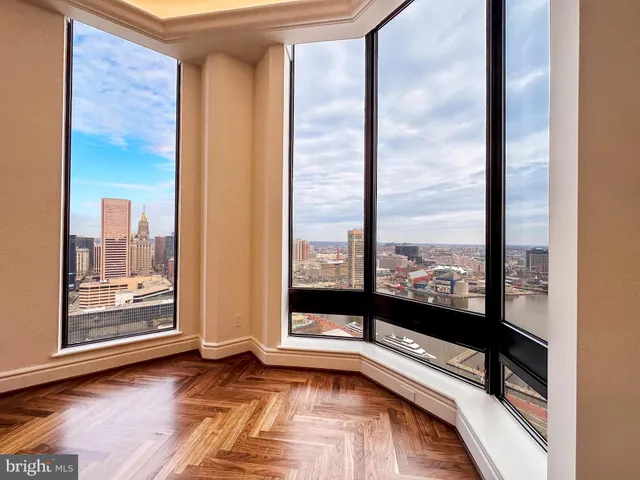 a spacious bathroom with a large tub and large window