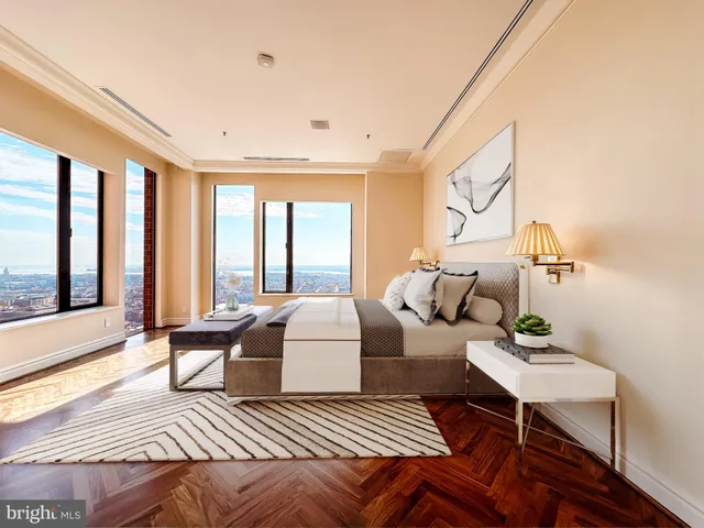 a spacious bathroom with a large tub and mirror