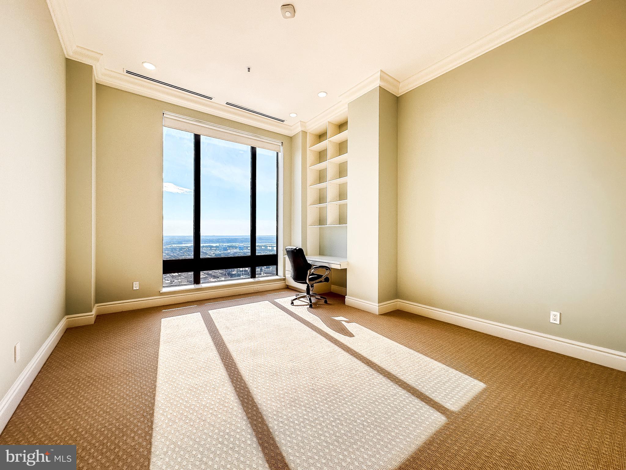 10 East Lee Street, Unit 2701 Baltimore, MD 21202 - Photo 44 of 58 a view of an empty room with a window