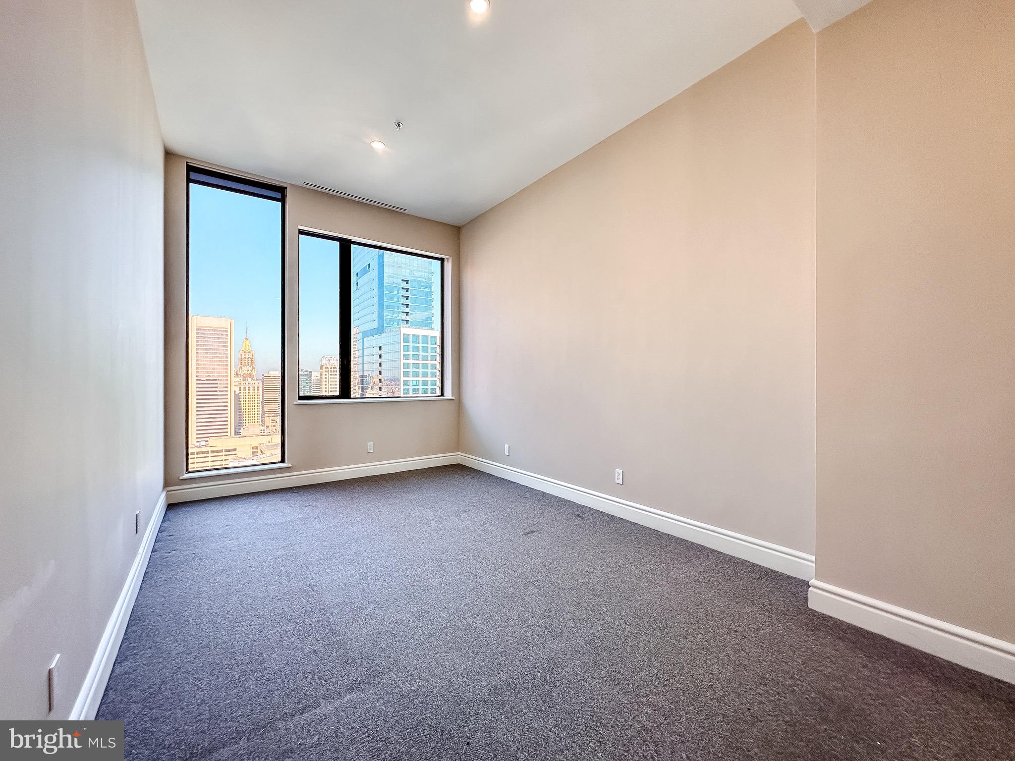 10 East Lee Street, Unit 2701 Baltimore, MD 21202 - Photo 49 of 58 an empty room with windows