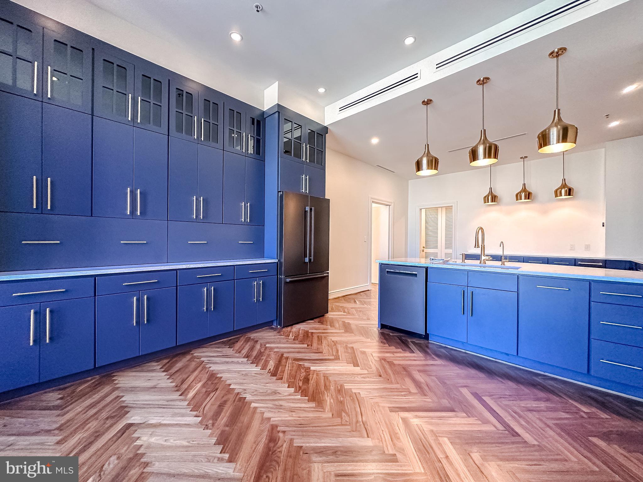 10 East Lee Street, Unit 2701 Baltimore, MD 21202 - Photo 6 of 58 a kitchen with stainless steel appliances granite countertop a stove a sink and a refrigerator