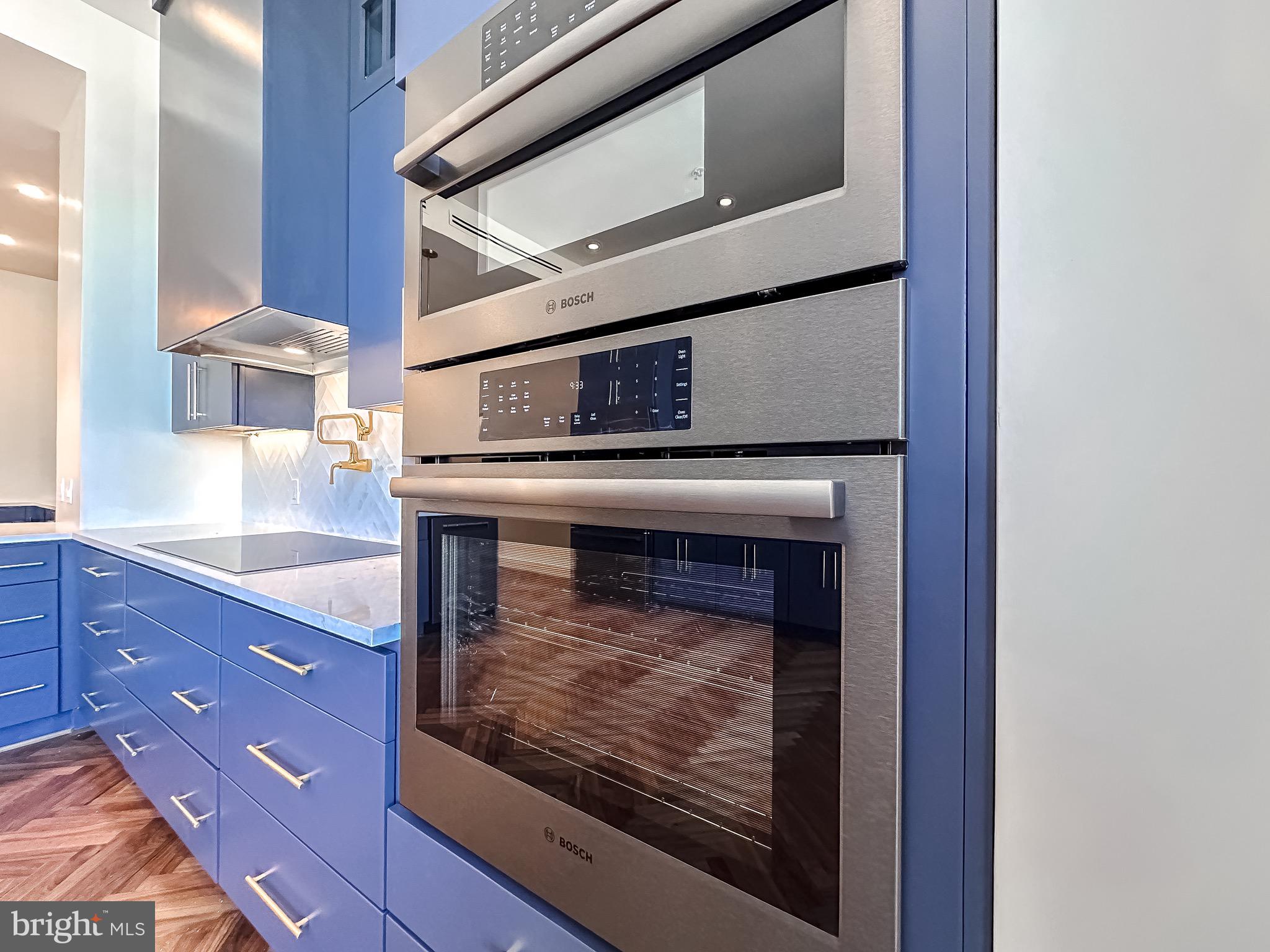 10 East Lee Street, Unit 2701 Baltimore, MD 21202 - Photo 9 of 58 a living room with furniture and a fireplace