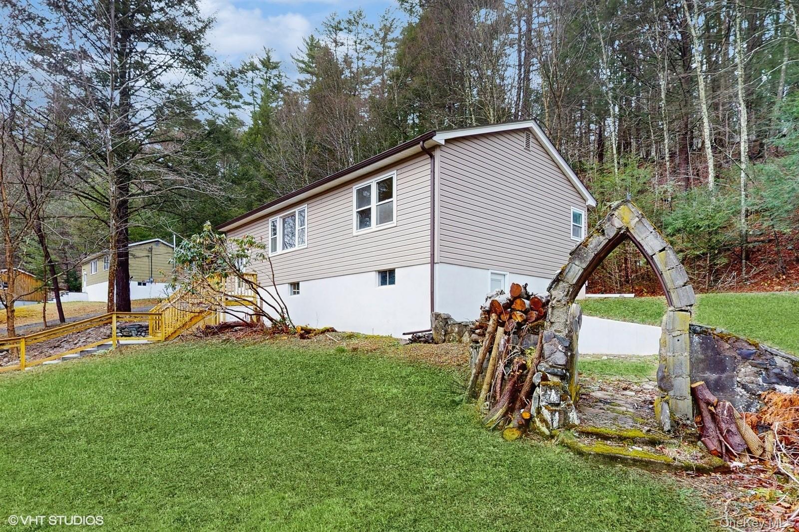 736 State Rte 55 Napanoch, NY 12458 - Photo 17 of 49 View of property exterior with a lawn