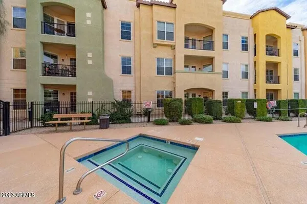 a swimming pool with outdoor seating and yard