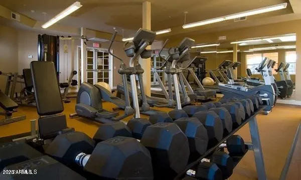 a view of gym room with gym equipment