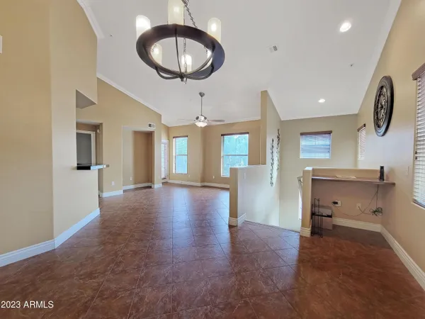 a view of a livingroom with furniture wooden floor and window