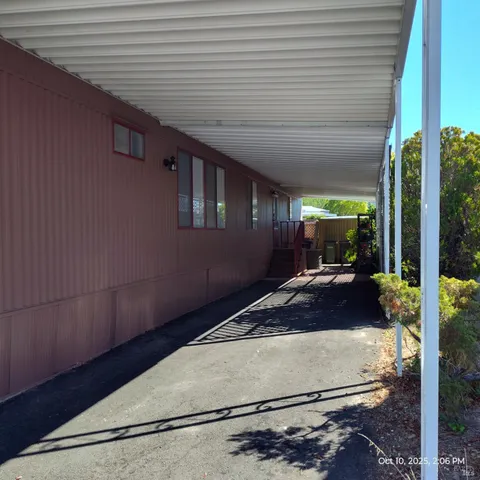 a view of a house with wooden fence