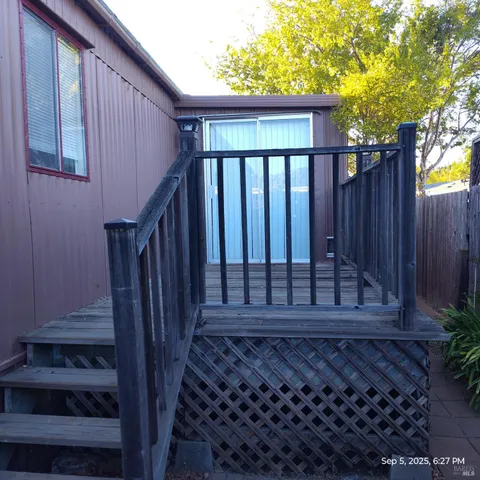 a view of a backyard with sitting area