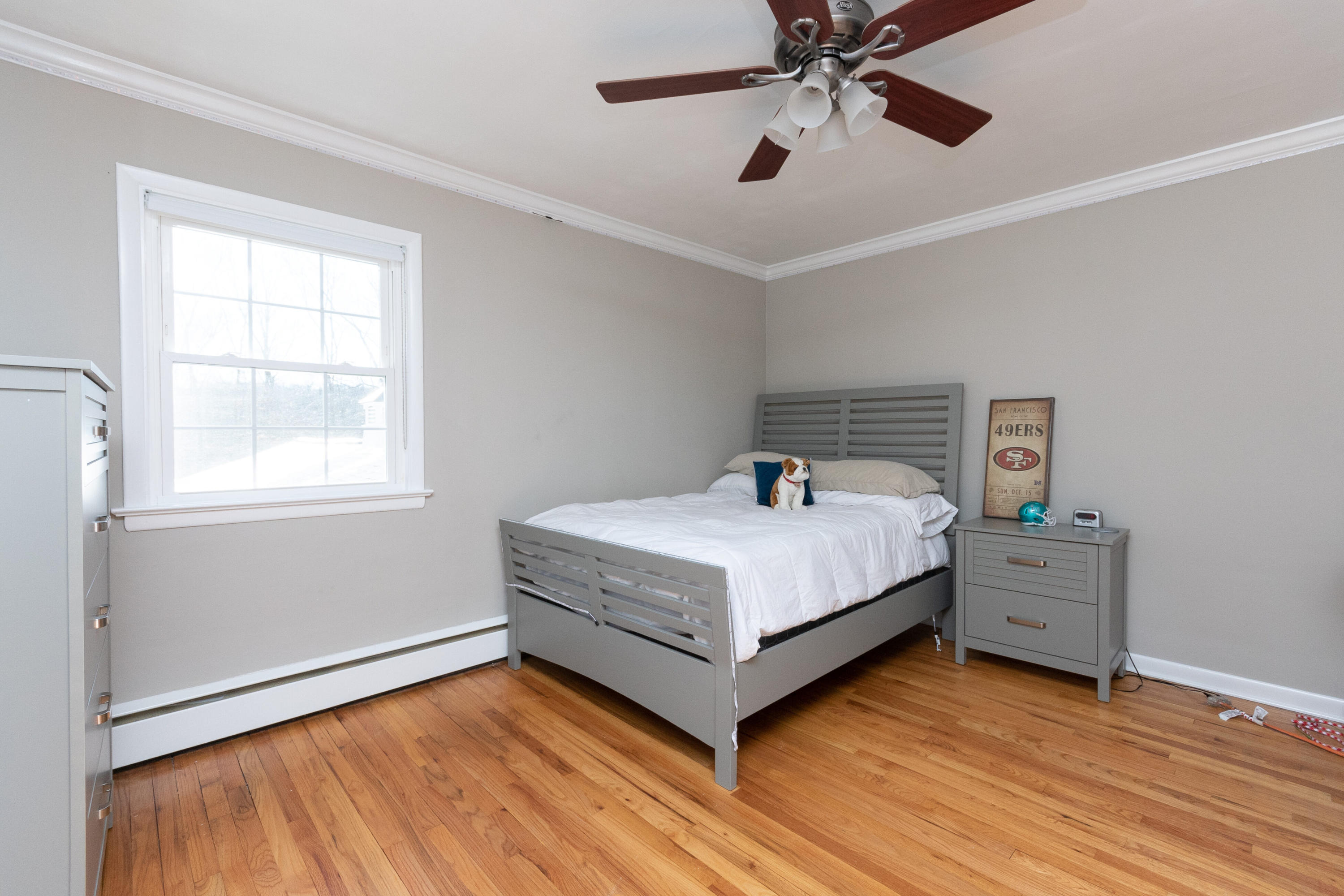 32 Colonial Road New Canaan, CT 06840 - Photo 11 of 22 a bedroom with a bed and a window