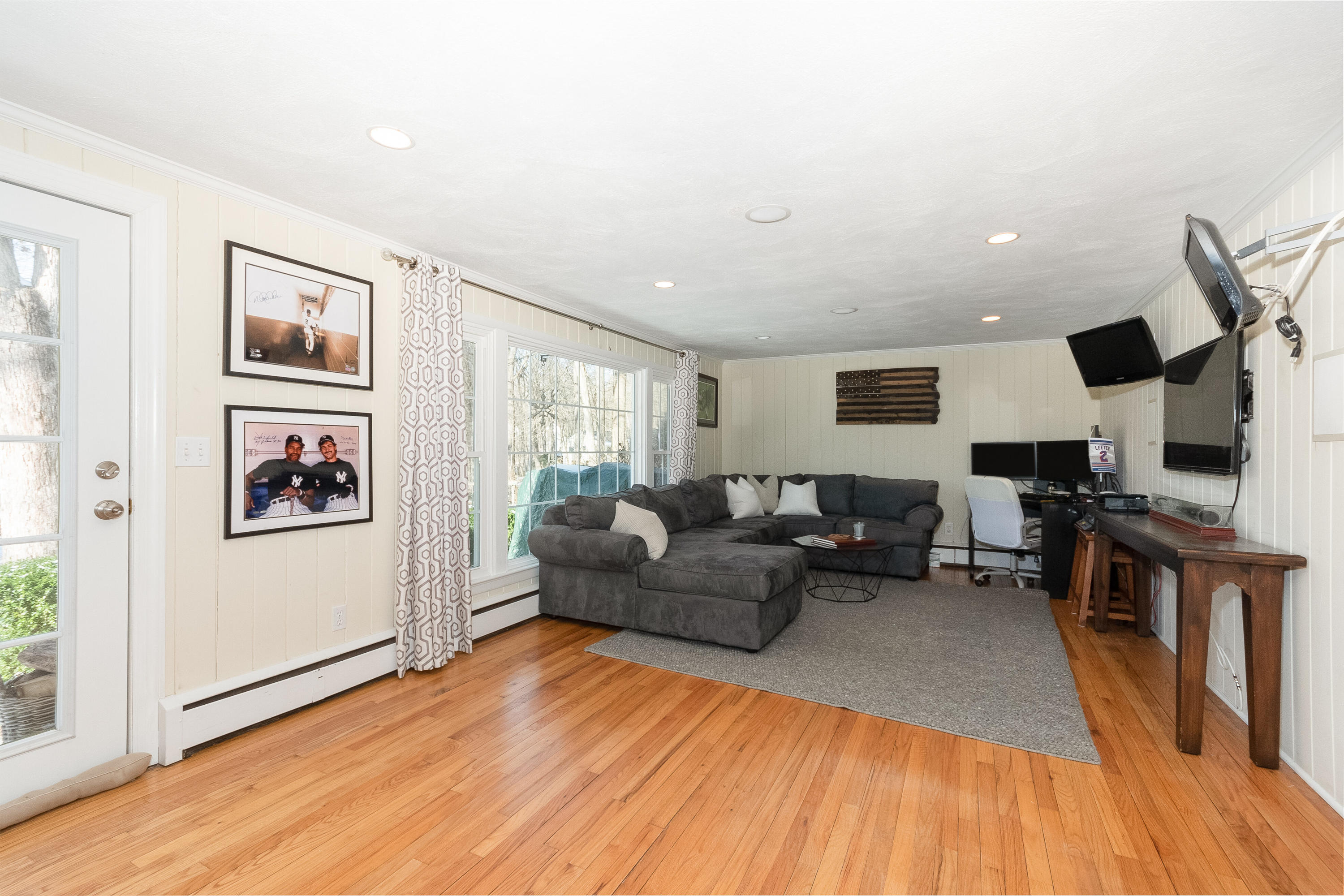 32 Colonial Road New Canaan, CT 06840 - Photo 14 of 22 a living room with furniture and a flat screen tv