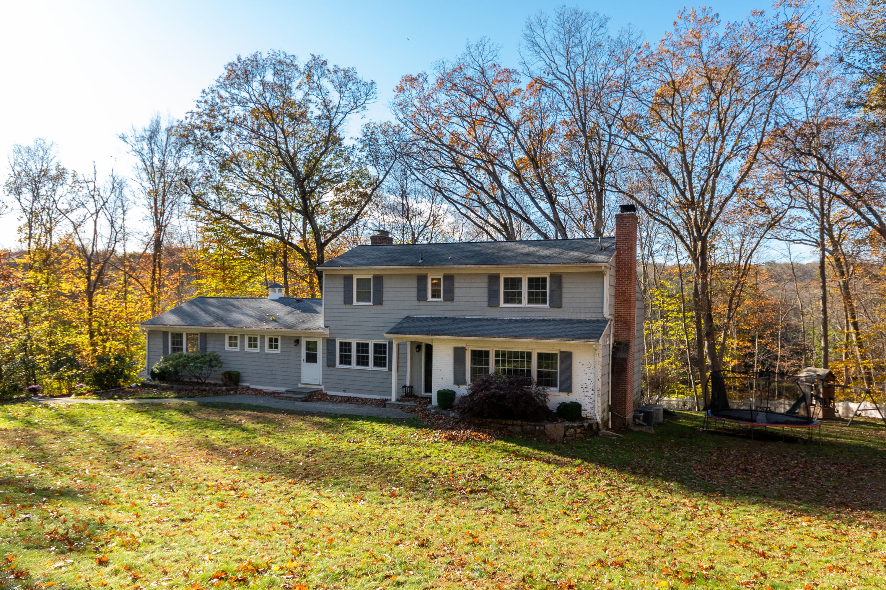 32 Colonial Road New Canaan, CT 06840 - Photo 18 of 22 a front view of a house with swimming pool