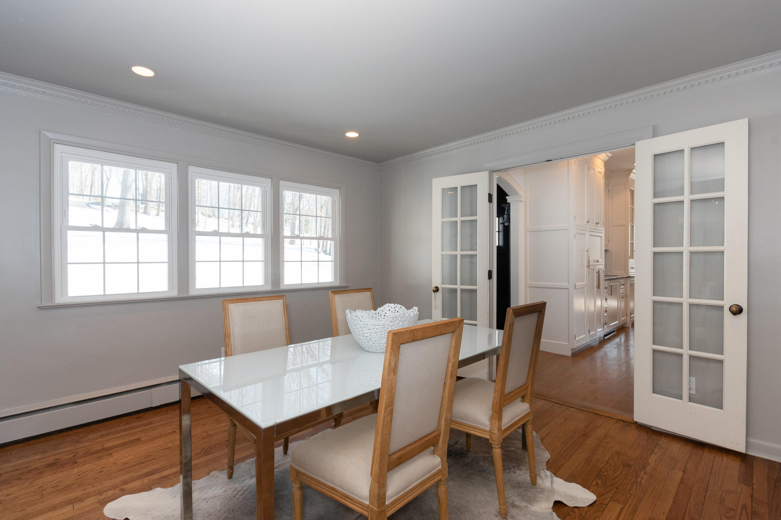 32 Colonial Road New Canaan, CT 06840 - Photo 4 of 22 a view of a dining room with furniture window and wooden floor