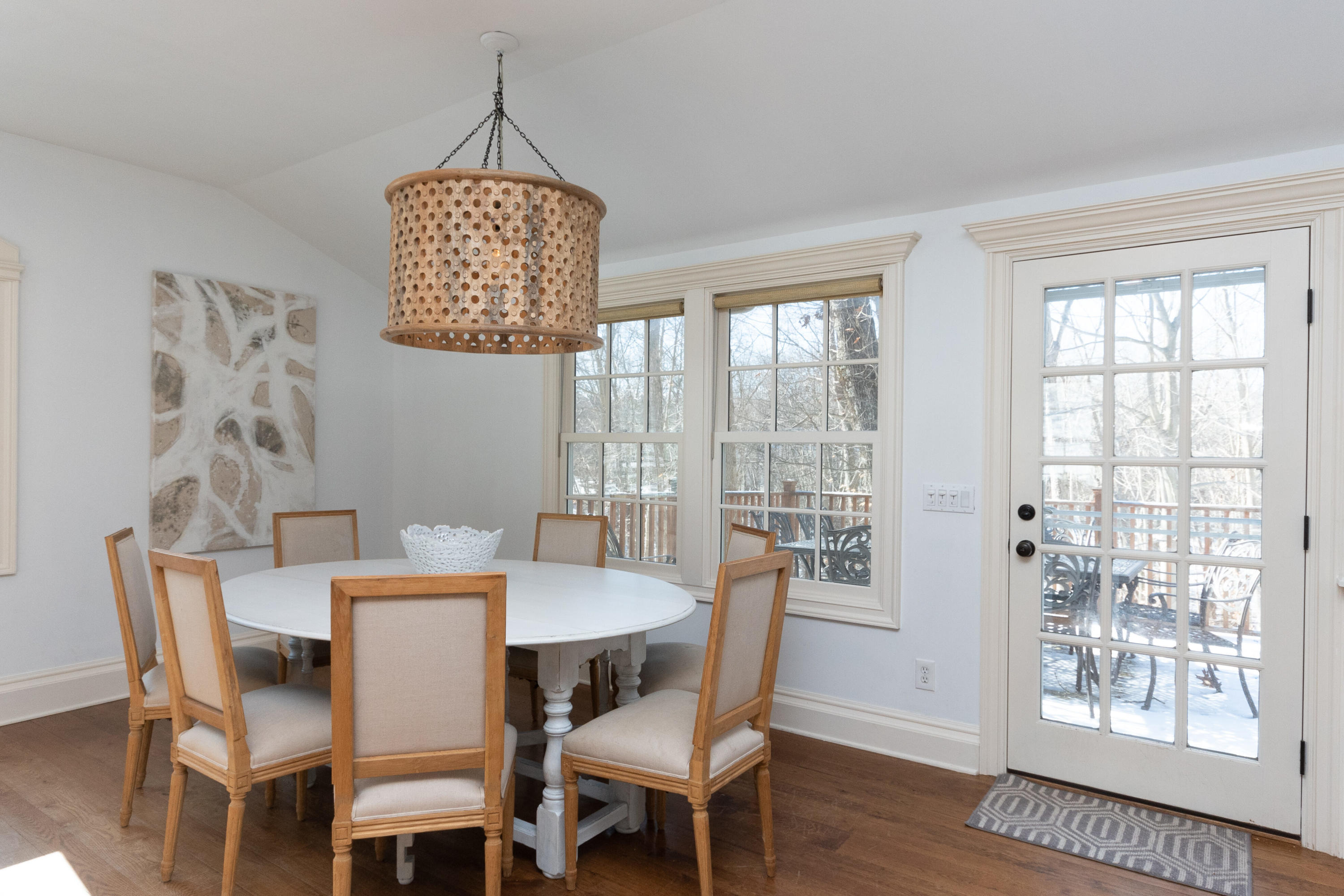 32 Colonial Road New Canaan, CT 06840 - Photo 6 of 22 a dining room with furniture a chandelier and wooden floor