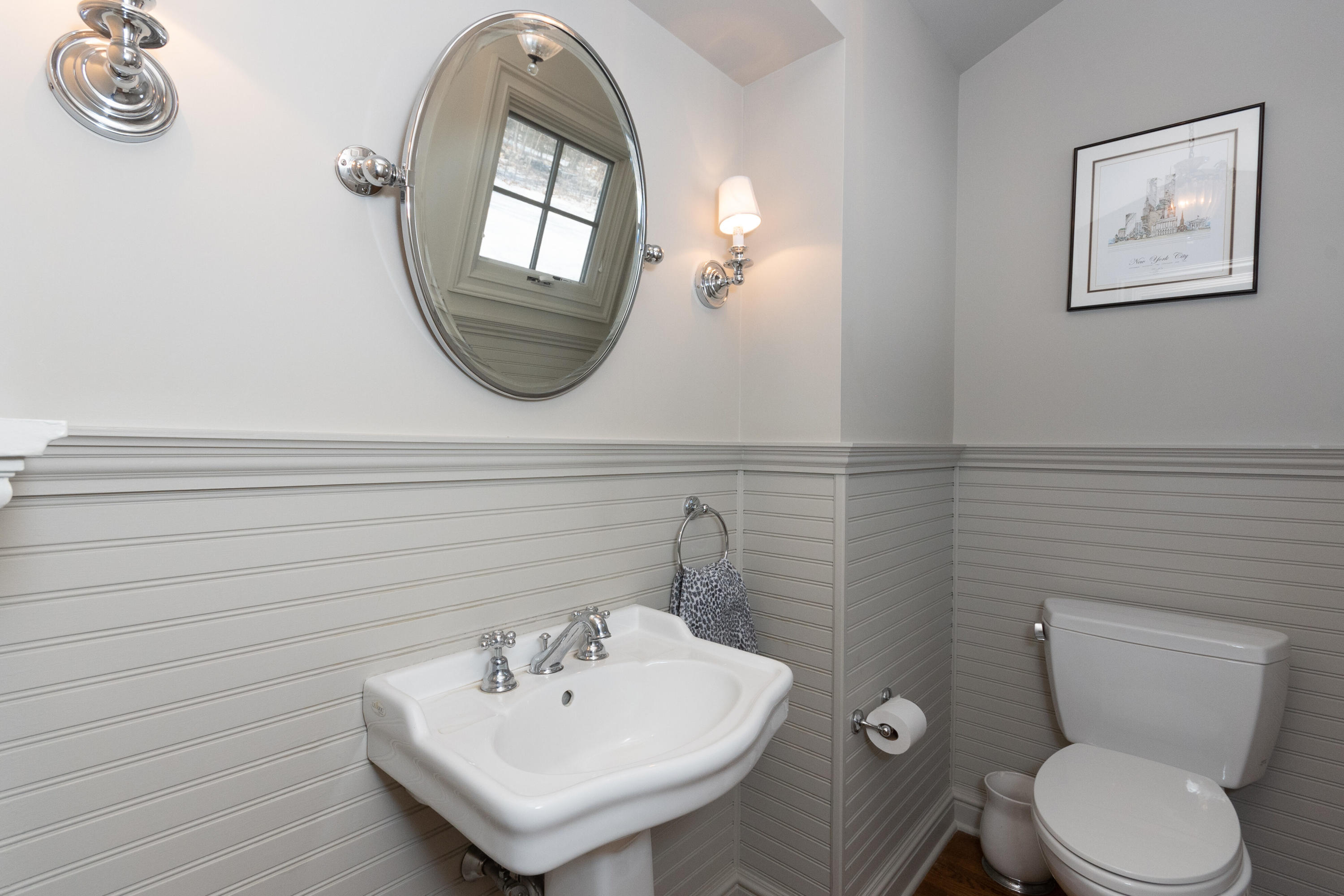 32 Colonial Road New Canaan, CT 06840 - Photo 9 of 22 a bathroom with a toilet a sink and mirror