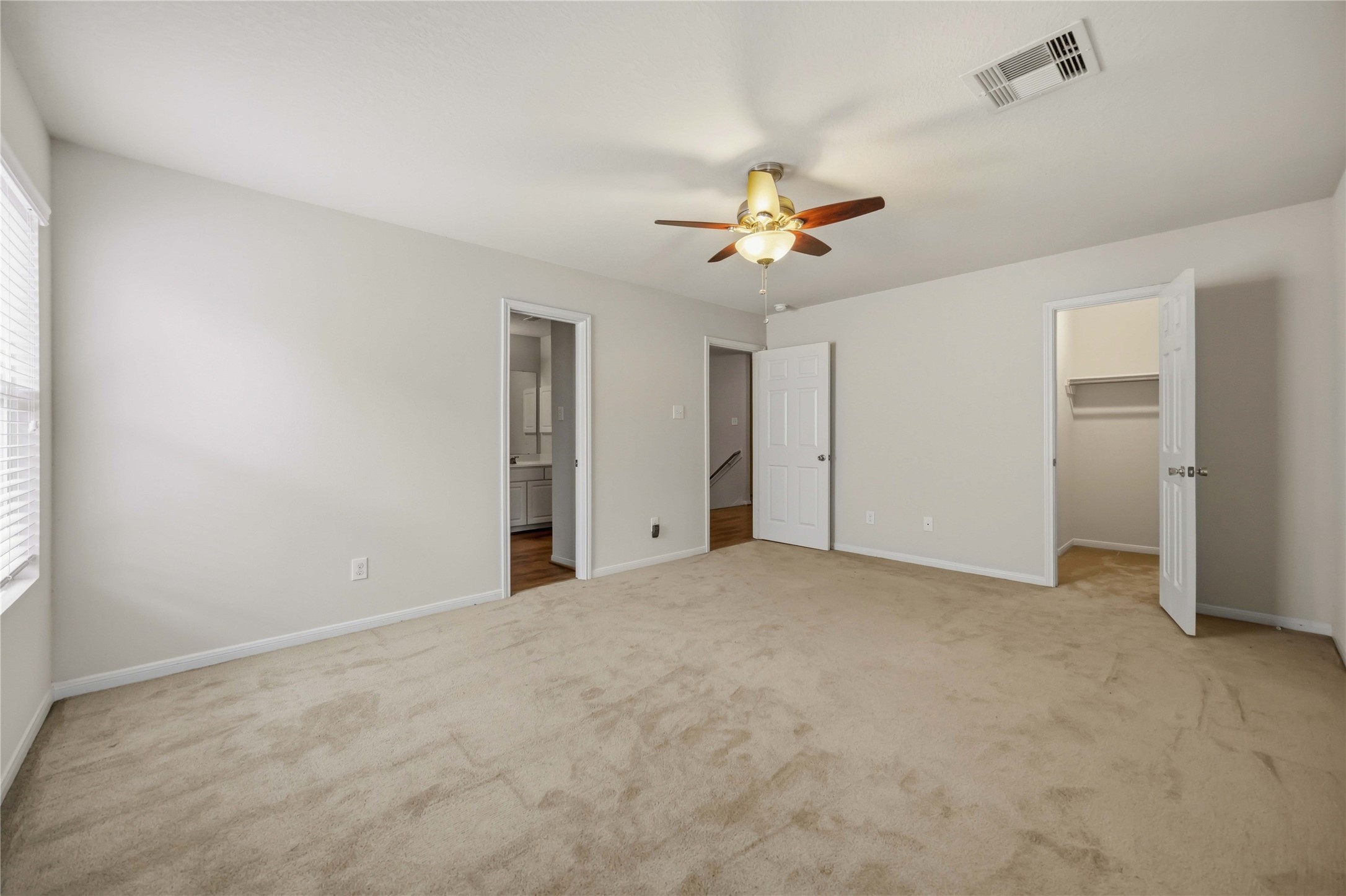 29526 Winton Wood Way Spring, TX 77386 - Photo 18 of 29 Private upstairs primary retreat with a spacious layout, walk-in closet, and en suite bath.