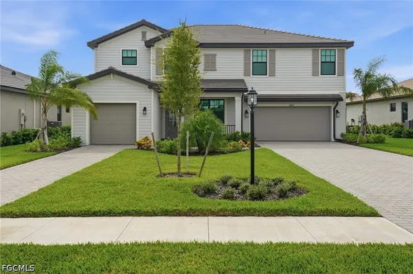 a front view of a house with a yard