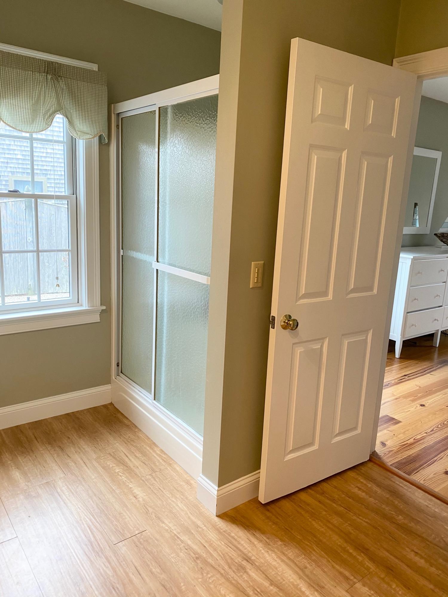 37 Horsefoot Path Dennis, MA 02638 - Photo 15 of 50 a view of an empty room with wooden floor and a window
