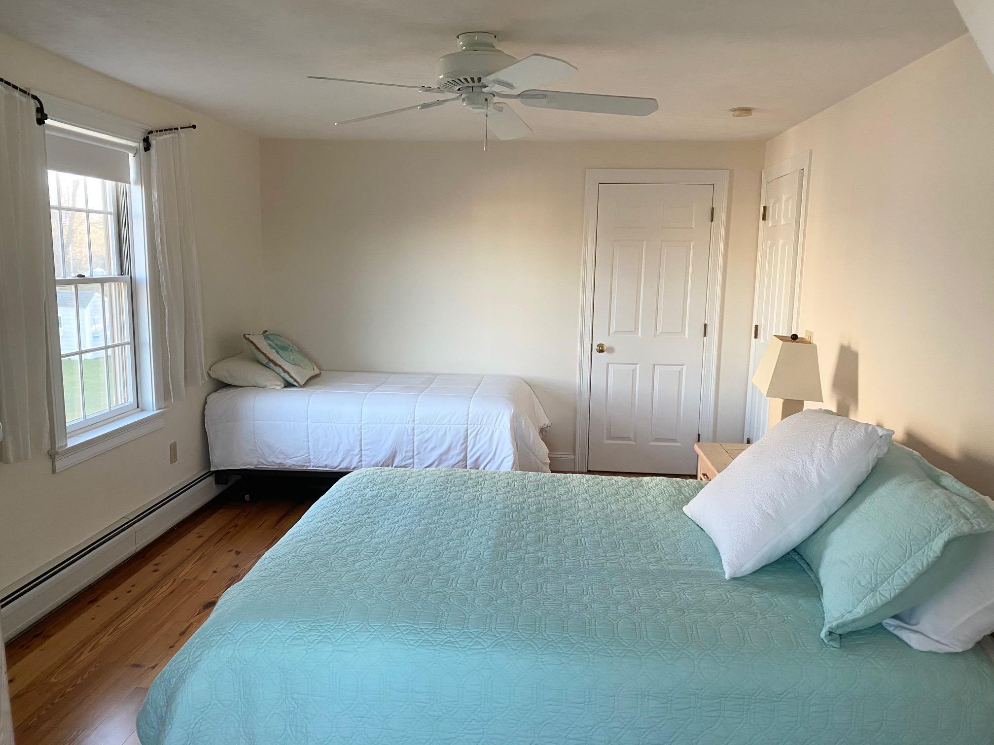 37 Horsefoot Path Dennis, MA 02638 - Photo 20 of 50 a bedroom with a bed and wooden floor