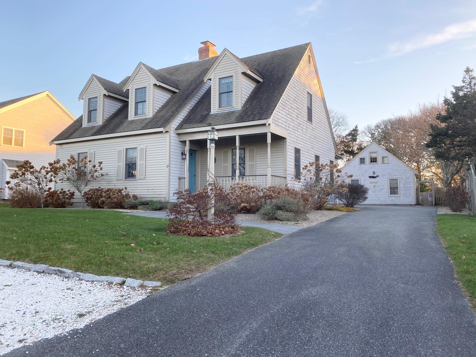 37 Horsefoot Path Dennis, MA 02638 - Photo 2 of 50 a front view of a house with garden