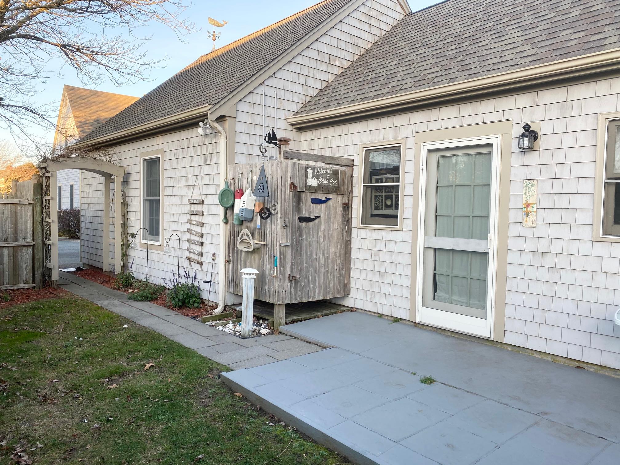 37 Horsefoot Path Dennis, MA 02638 - Photo 28 of 50 a front view of a house with a yard