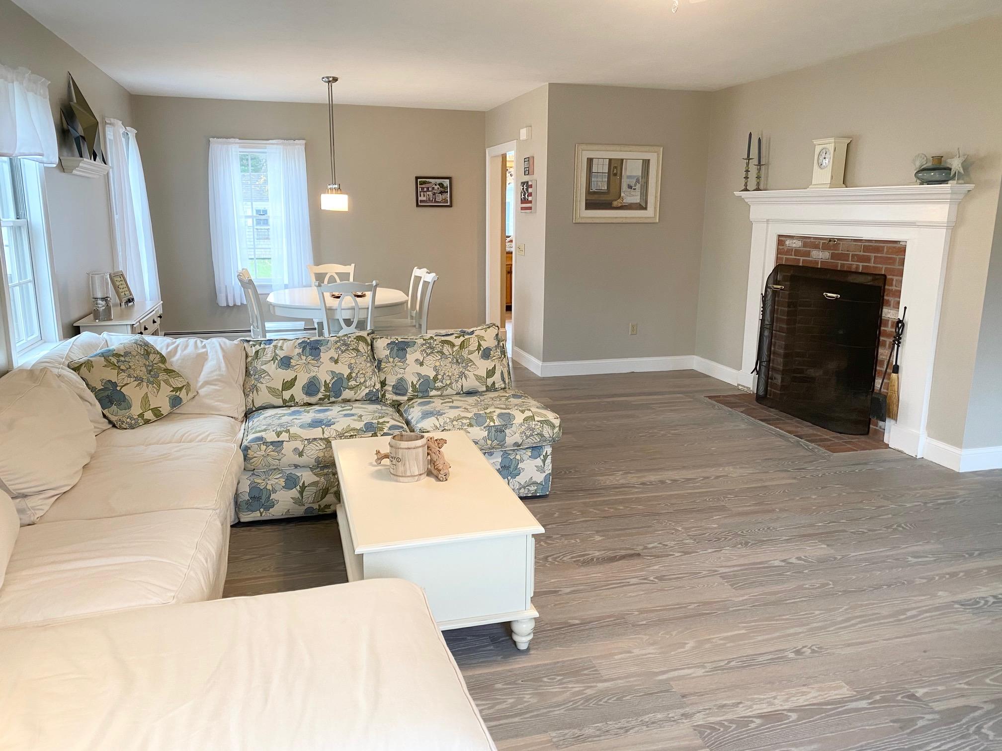 37 Horsefoot Path Dennis, MA 02638 - Photo 3 of 50 a living room with furniture and a fireplace