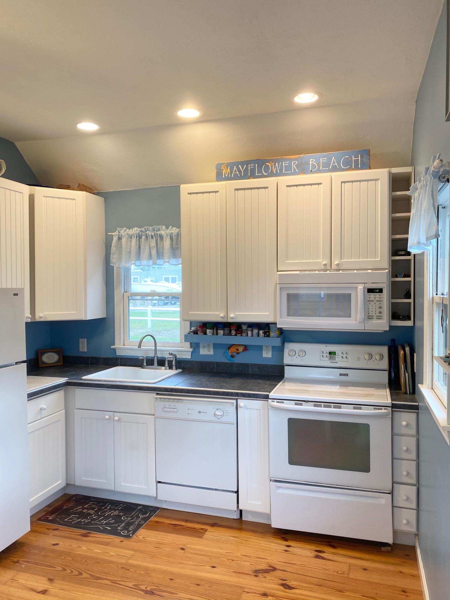 37 Horsefoot Path Dennis, MA 02638 - Photo 31 of 50 a kitchen with stainless steel appliances granite countertop a sink and cabinets