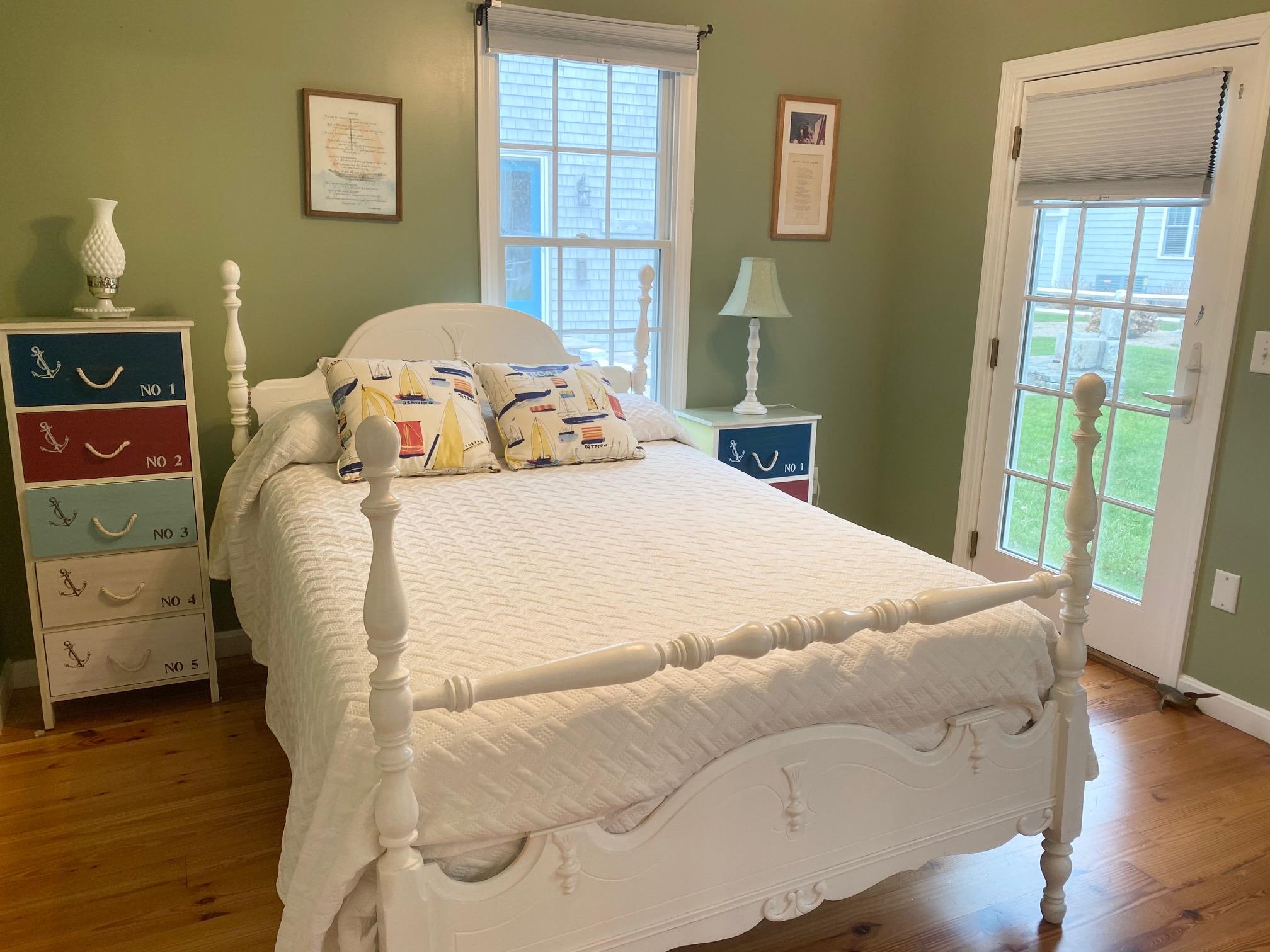 37 Horsefoot Path Dennis, MA 02638 - Photo 33 of 50 a bedroom with a bed and wooden floor