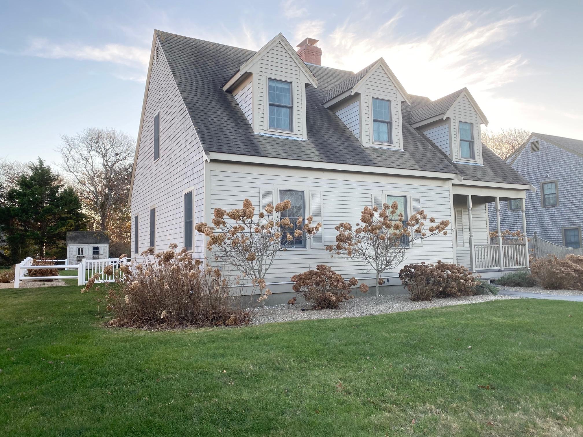 37 Horsefoot Path Dennis, MA 02638 - Photo 45 of 50 a front view of a house with garden
